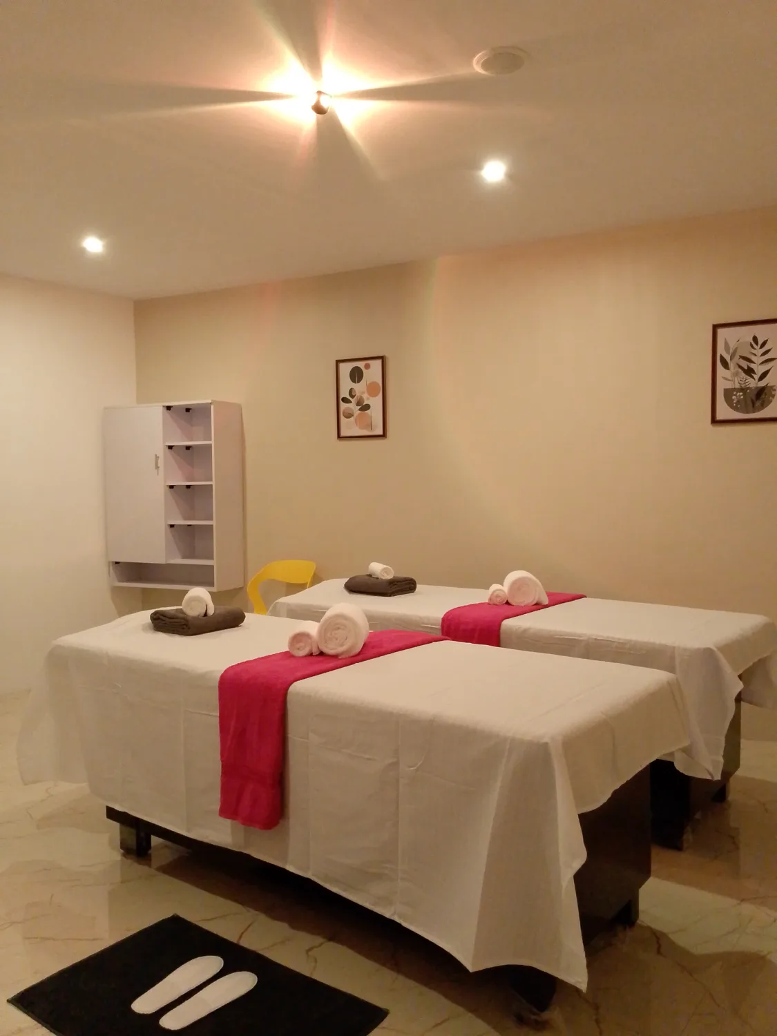 Aaron Spa twin treatment room with neatly prepared massage beds